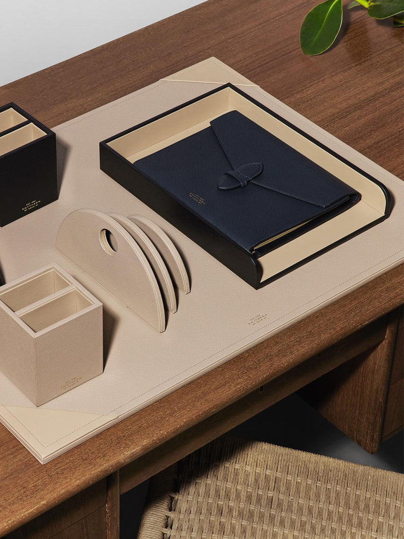 Cream and dark leather organized desk